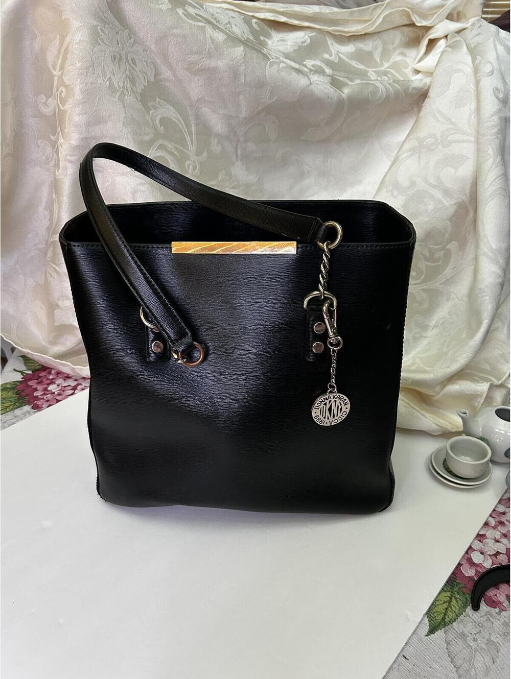Donna Karan Black Leather Tote Bag with Gold Accent and Charm